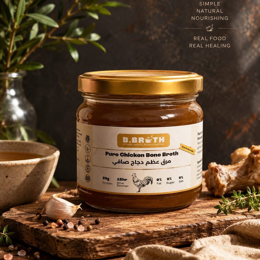 B.Broth Pure Chicken Bone Broth jar on a wooden board with herbs and spices